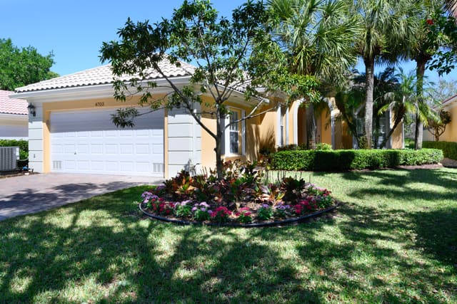 4703 Dovehill Drive, sold in Magnolia Bay, Palm Beach Gardens, FL