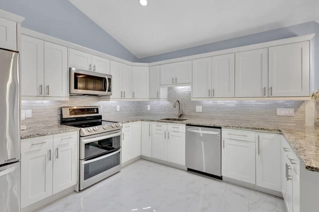 12528 Woodmill Drive, sold in Westwood Lakes 4 Westwood Gardens, Palm Beach Gardens, FL