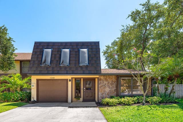 1048 Raintree Drive, sold in Rainwood East Replat, Palm Beach Gardens, FL
