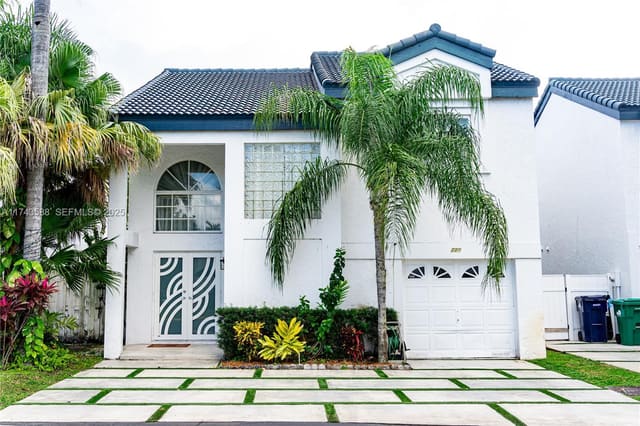 220 NE 211th Street, sold in San Simeon Homes, Miami, FL