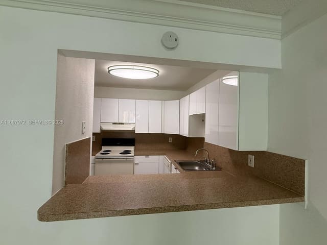 7000 NW 186th Street 4-114, sold in Coral Gate West Condo, Hialeah, FL