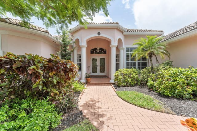 554 N Cypress Drive, sold in Cypress Ridge, Tequesta, FL