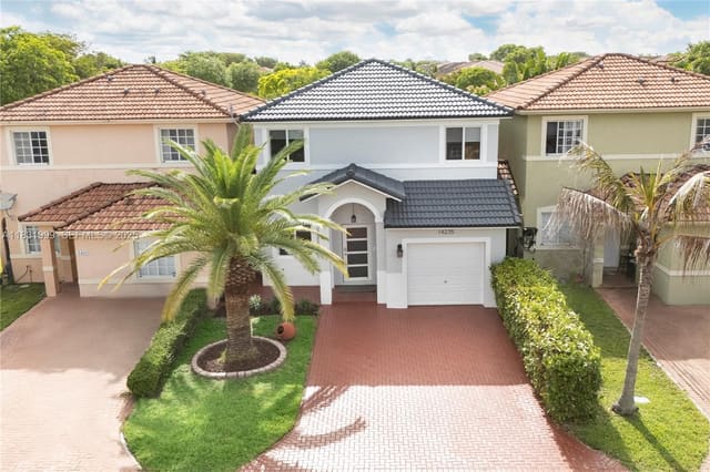 14235 SW 133rd Court, sold in Precious Homes At Twin La, Miami, FL