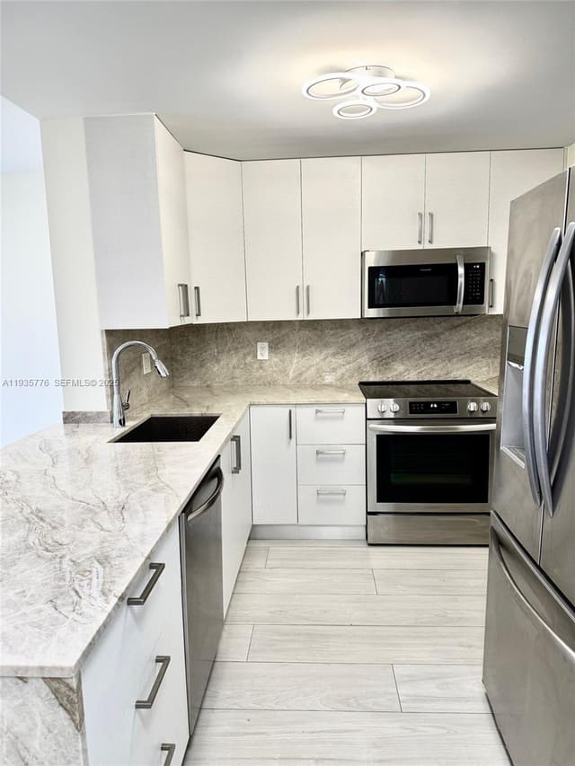 401 Golden Isles Drive 701, sold in Ocean View Towers Condo, Hallandale Beach, FL