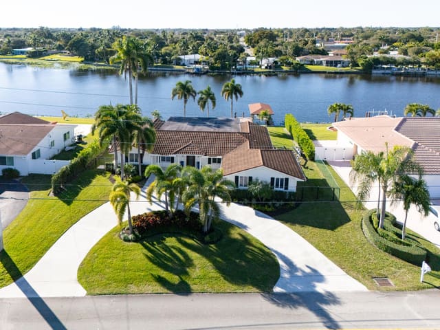 7025 Pine Tree Lane, sold in Lake Clarke Isle 3, Lake Clarke Shores, FL
