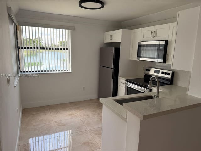 1002 Adams Avenue 1002F, sold in Lakeshore Condo 6, Homestead, FL