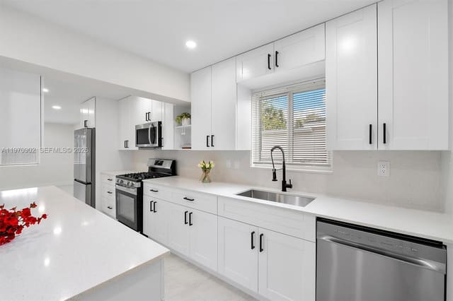 3740 NW 9th Court, sold in Plaza Estates, Lauderhill, FL