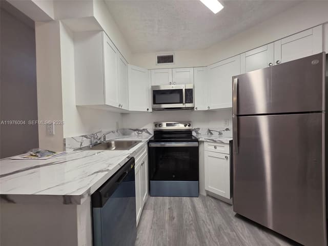210 Lake Pointe Drive 304, sold in Lake Pointe Condominium N, Oakland Park, FL