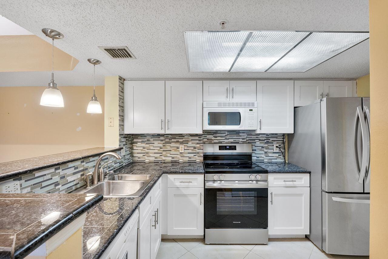 5011 Wiles Road Unit 303 — photo 2